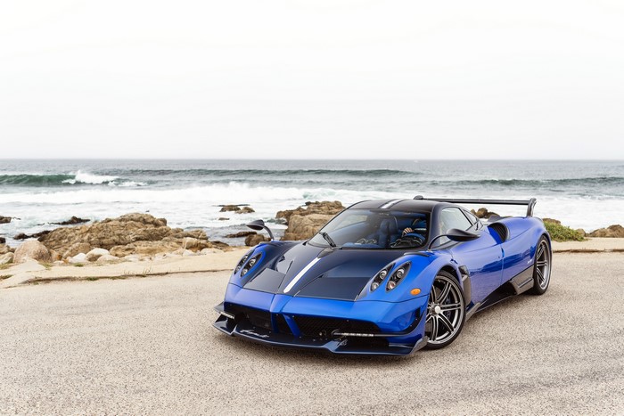 Blue Pagani Huayra BC on a rocky coast