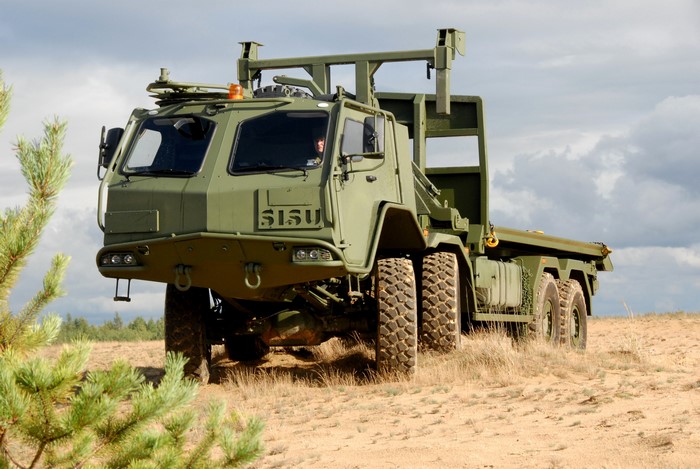 SISU military truck with crane in sandy terrain