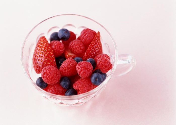 Fresh berries in a glass bowl