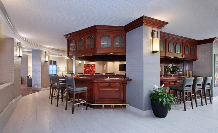 Interior design of a bar with chairs and lamps