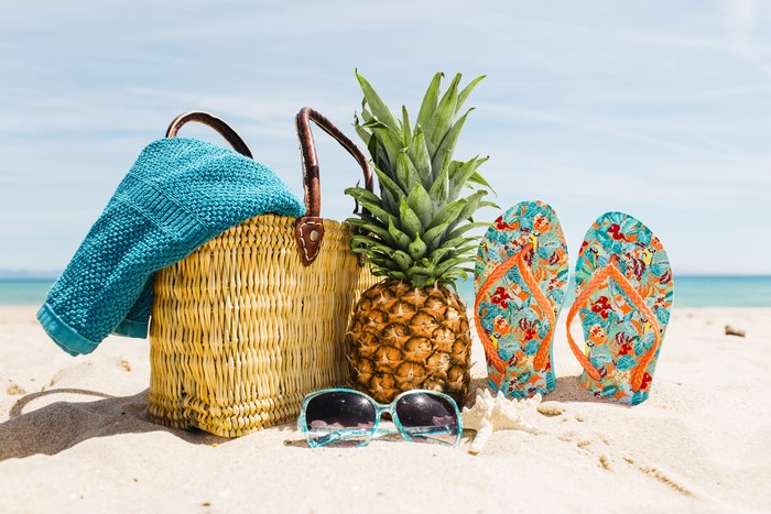 Beach accessories with pineapple and flip-flops