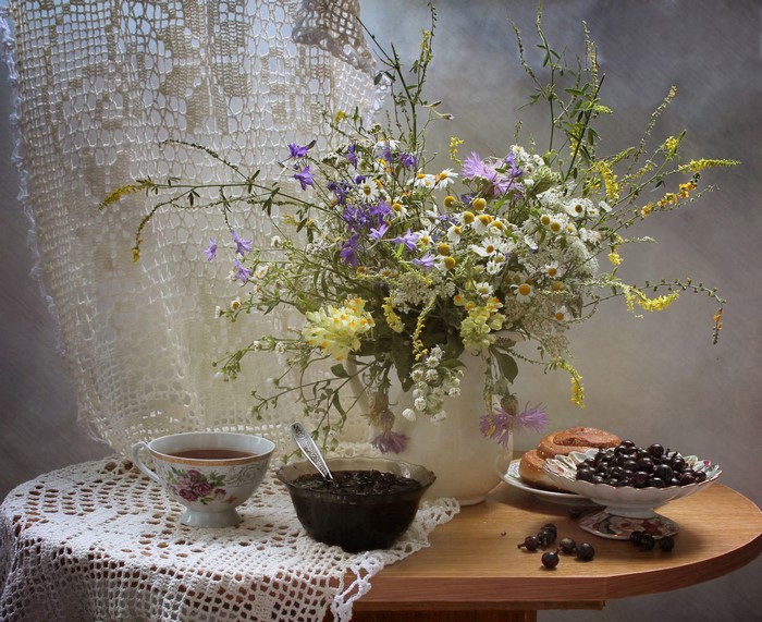 Still-life with bouquet, tea, jam, and berries