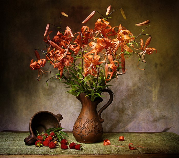 Still-life with lilies and raspberries in a vase