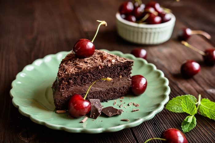 Chocolate cake with cherries on a plate