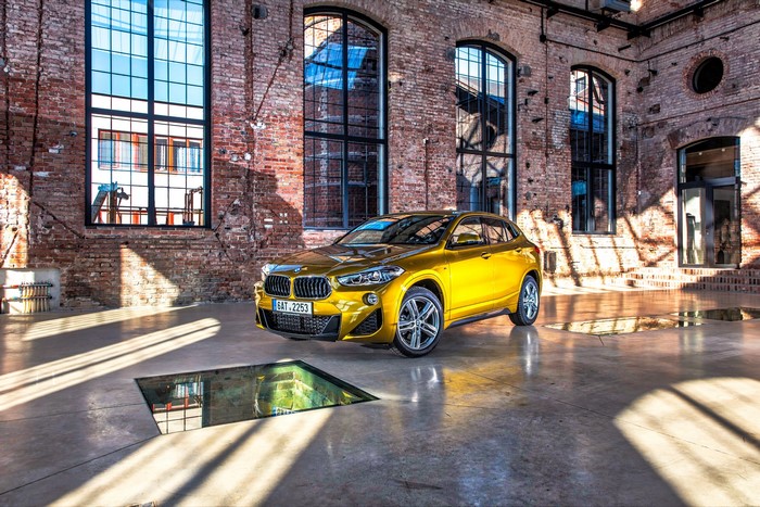 Gold BMW X2 F39 Crossover in Industrial Interior
