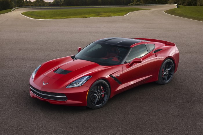 Red 2014 Chevrolet Corvette Stingray on asphalt