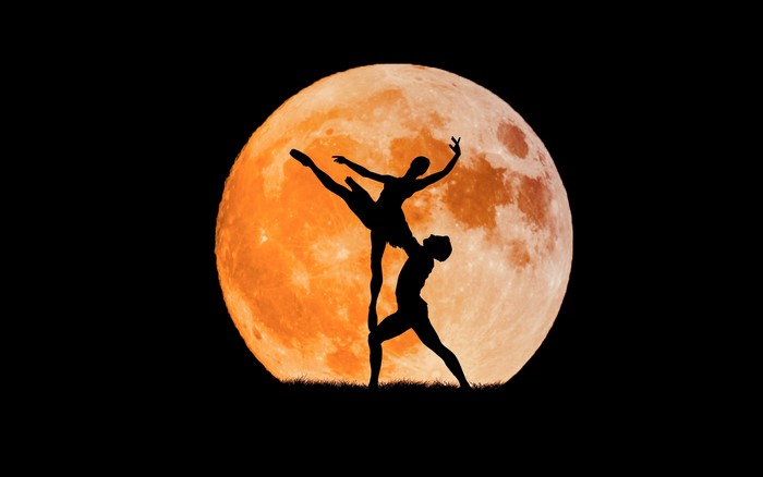Ballet Dancers Silhouette Against Full Moon