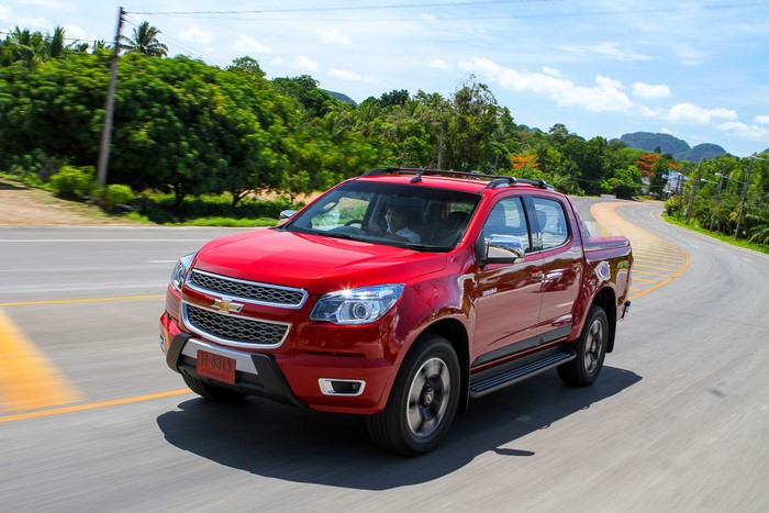 Red Chevrolet Colorado Pickup Truck on Road