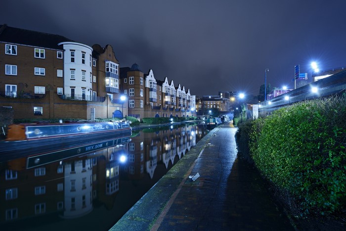 Birmingham canal at night with houseboats and reflections