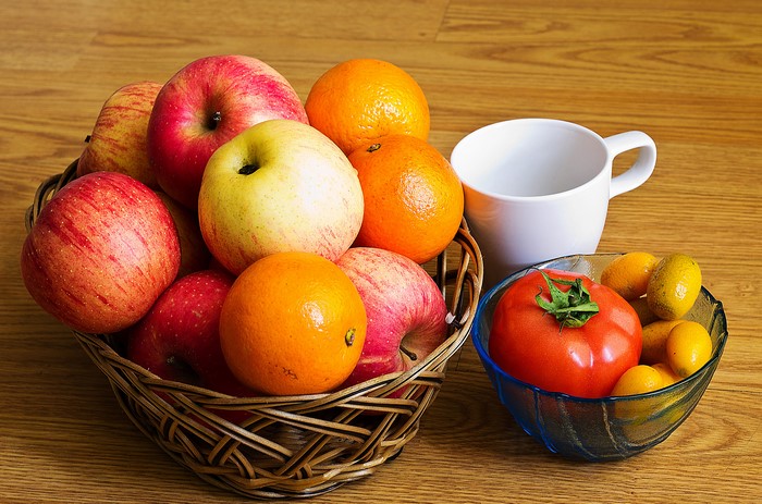 Basket of Apples and Oranges with Tomato and Kumquats