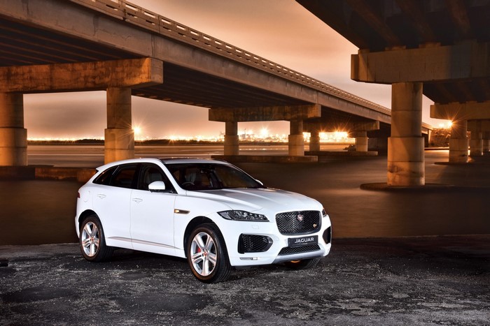 White 2016 Jaguar F-Pace S 30d AWD under a bridge