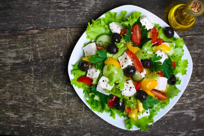 Greek salad with feta cheese, olives, and tomatoes
