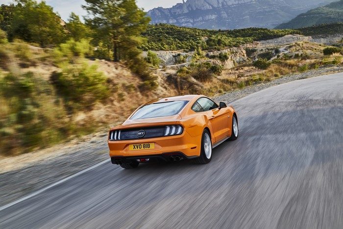 2018 Ford Mustang GT 5.0 driving on a mountain road