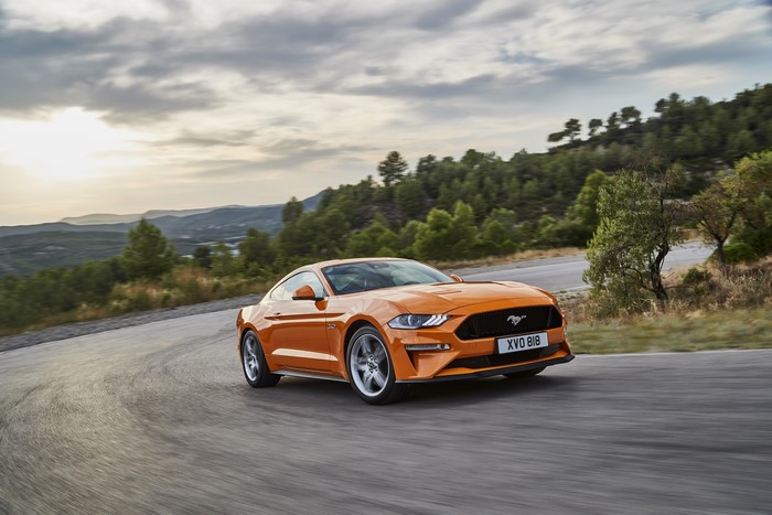 Orange 2018 Ford Mustang GT 5.0 on a Road
