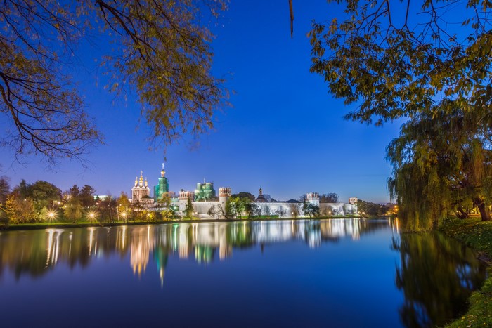 Novodevichy Convent reflected in a river at dusk, Moscow, Russia