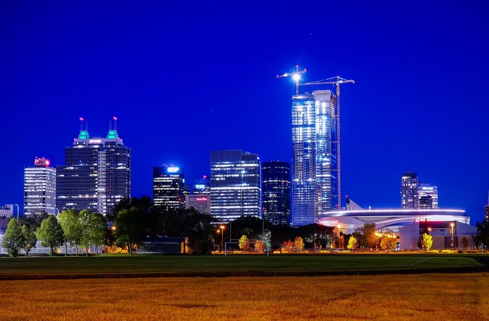 Edmonton skyline at night with construction cranes