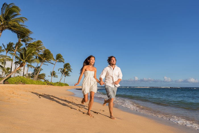 Couple running on a beach