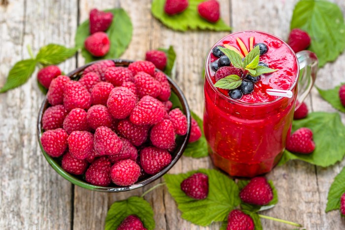 Raspberry smoothie with fresh raspberries and blueberries