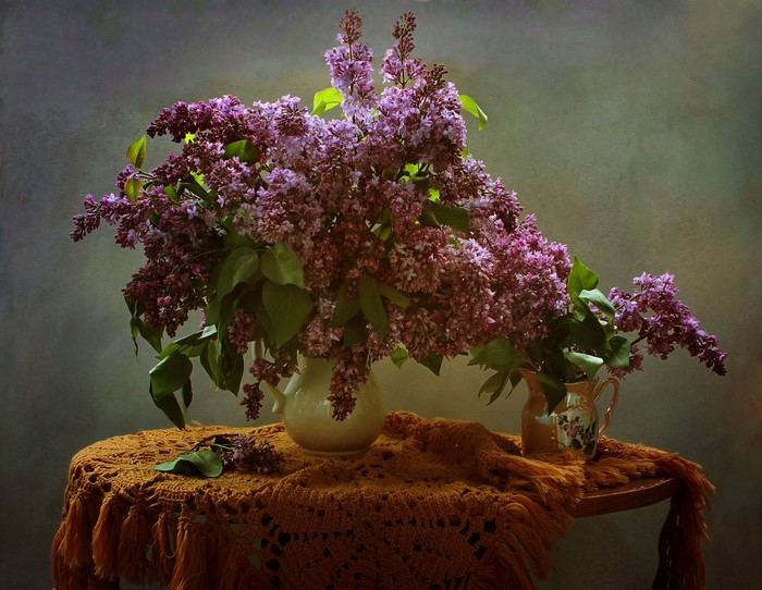 Bouquet of lilacs in a vase on a table