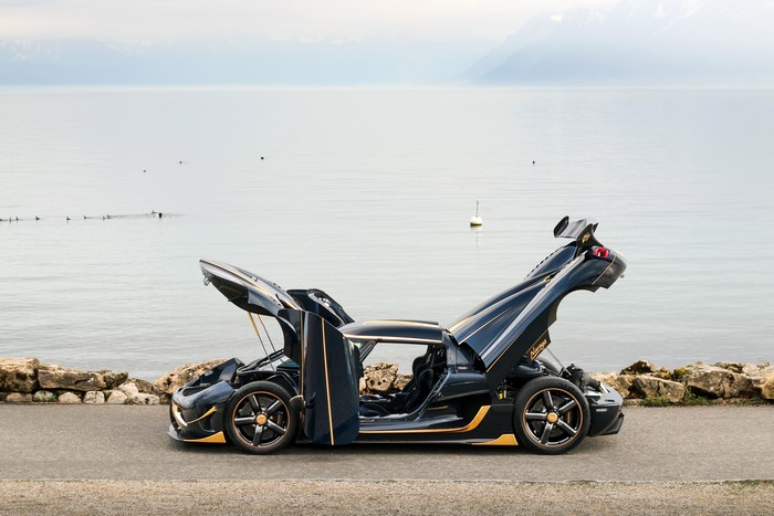 Koenigsegg Agera RS Naraya with doors open by lake