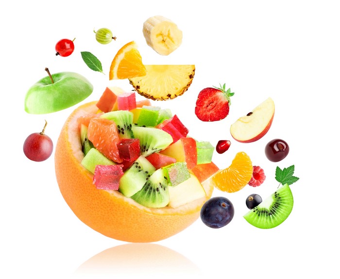 Fruit salad in grapefruit with flying fruits
