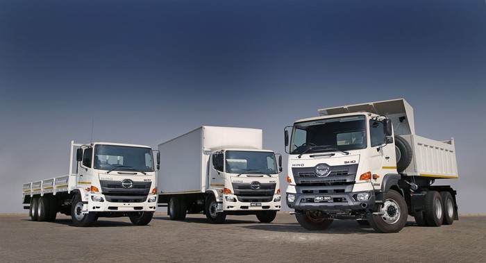 Three White Hino Trucks