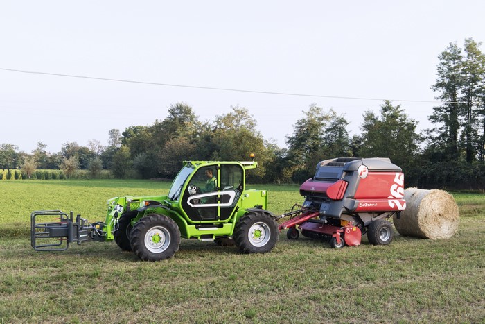 Merlo TF 42.7TT CS telehandler with baler in field