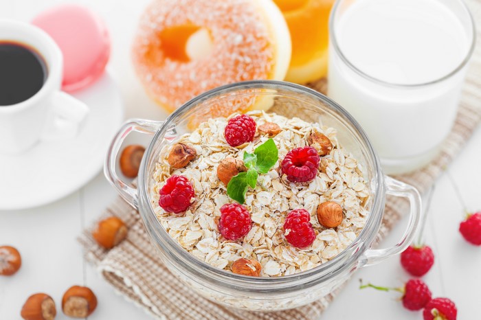 Oatmeal with raspberries and nuts for breakfast