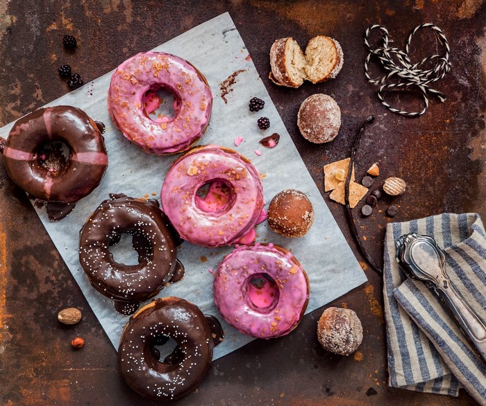 Assortment of donuts and pastries on a rustic surface