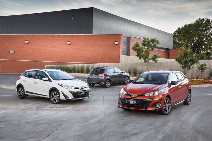 Three Toyota Yaris cars in a parking lot