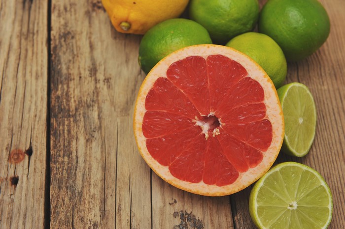 Grapefruit, Limes, and Lemon on Wood Planks