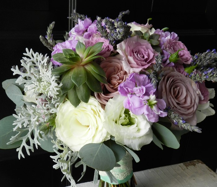 Wedding bouquet with roses, eustoma, and lavender