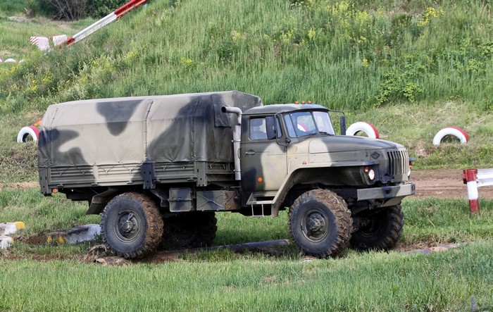 Ural-43206-0111-31 military truck on off-road course