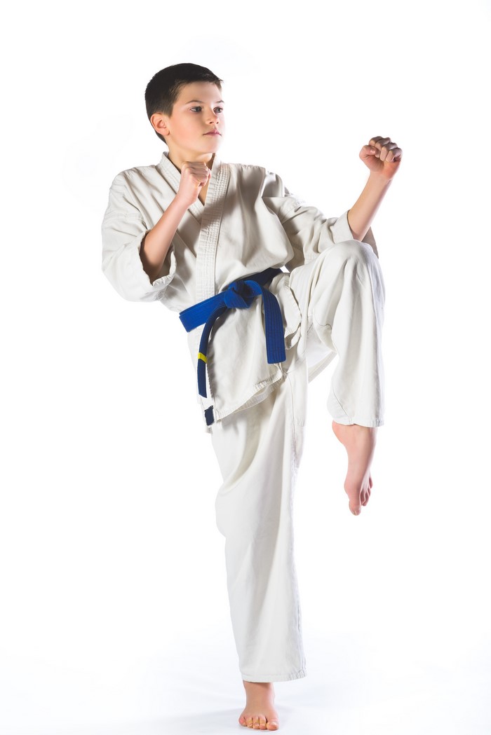 Boy in Karate Uniform with Blue Belt
