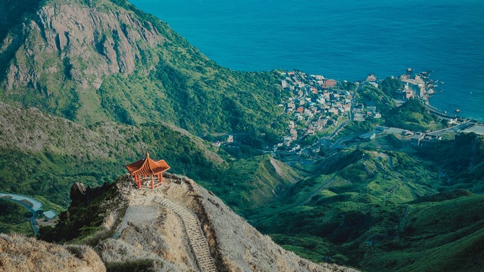 Mountainous landscape with coastal town and pagoda in Taiwan