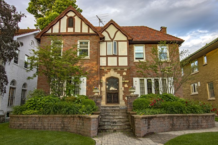 Brick Tudor Revival House with Landscaping