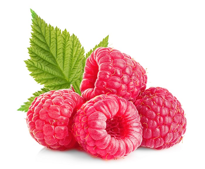 Raspberries with leaves on white background