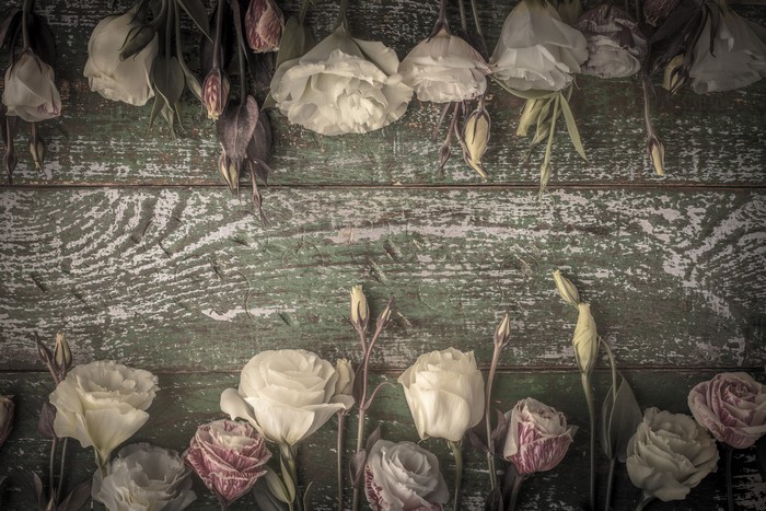 Eustoma flowers on weathered wood planks