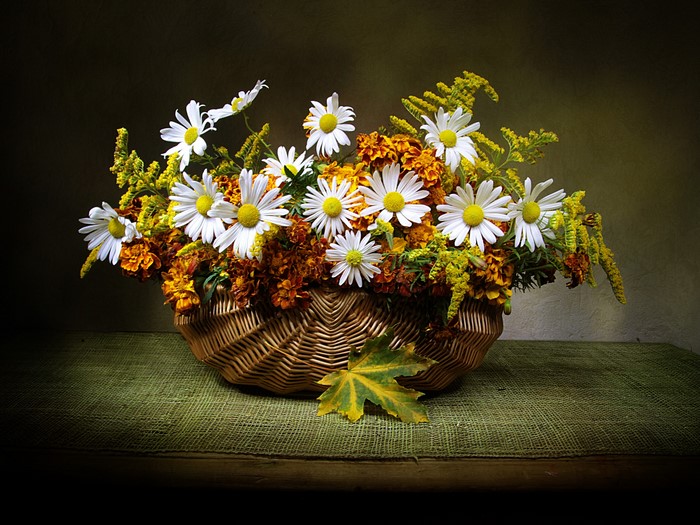 Basket of Daisies and Marigolds on Table