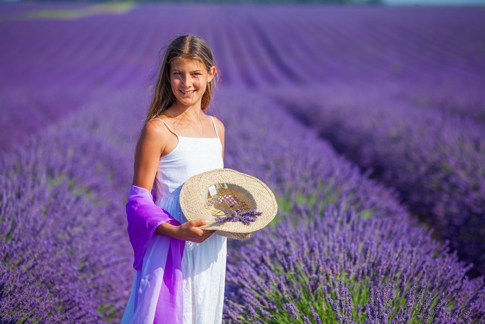 Girl in Lavender Field Holding Hat