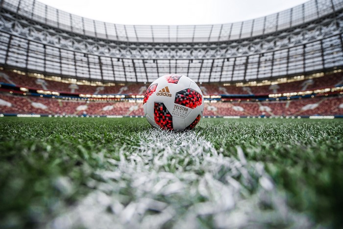 Adidas Telstar 18 football on stadium grass