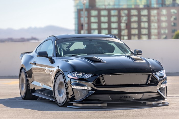 Black Ford Mustang Fastback with custom modifications