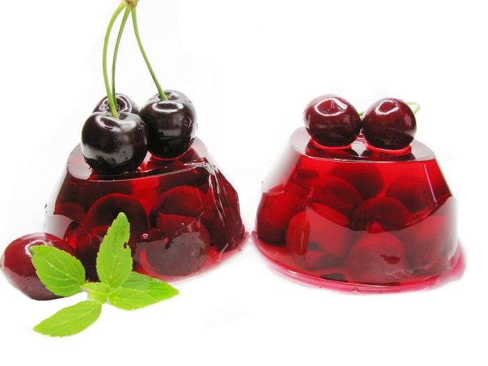 Cherry gelatin desserts with mint leaves