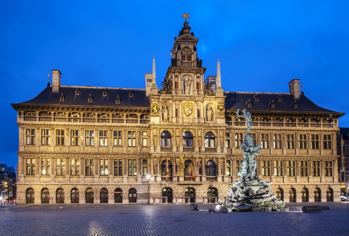 Antwerp City Hall and Brabo Fountain at dusk