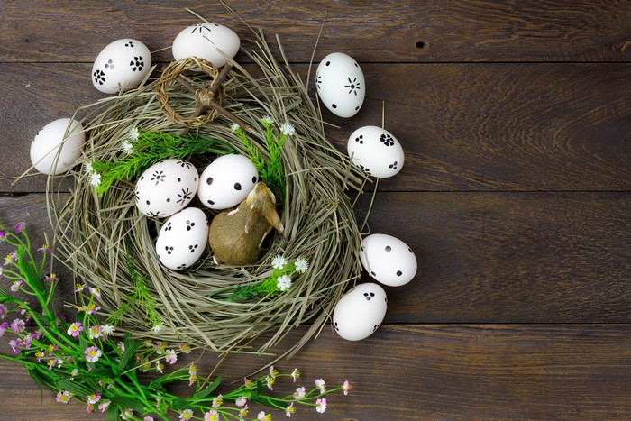 Easter eggs in a nest with flowers