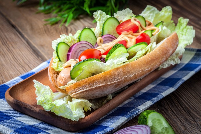 Hot dog with fresh vegetables and sauce