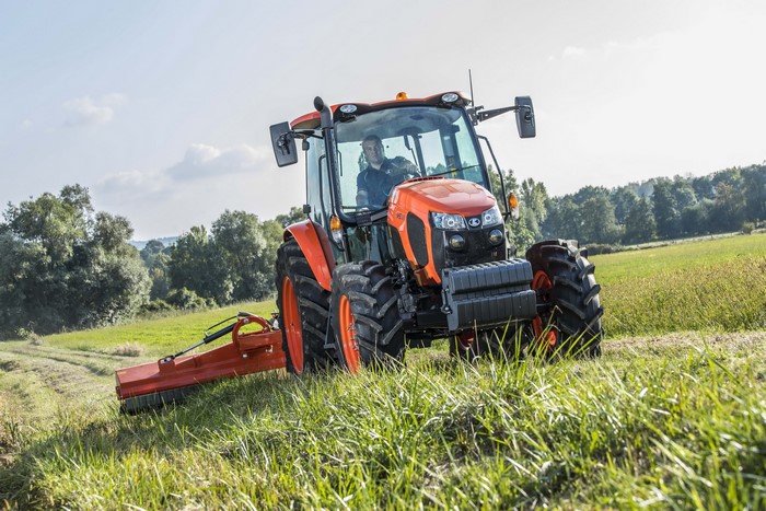 2016-17 Kubota M5111 tractor mowing a field