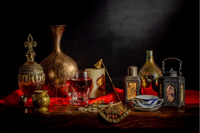 Still-life with antique objects and wine
