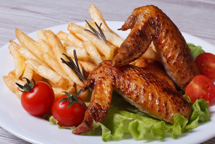 Roast Chicken Wings with French Fries and Tomatoes