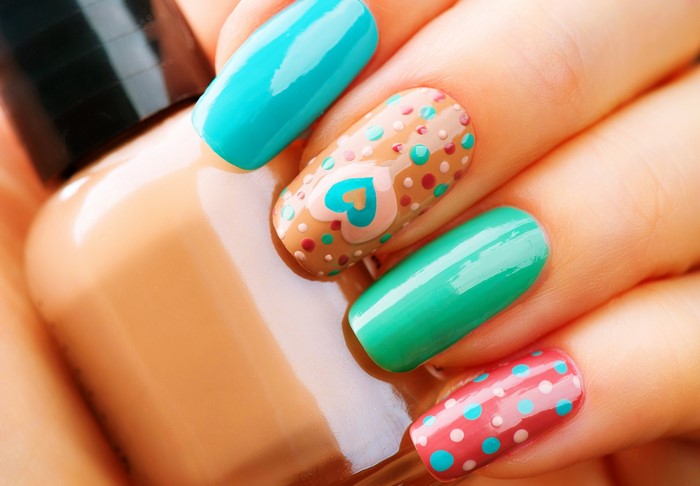 Nail art with hearts and polka dots